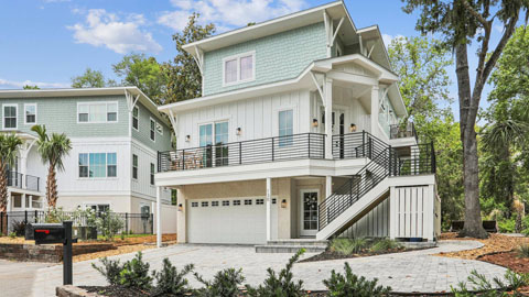 130 Shell Midden Lane. a three-story house with aqua green top floor