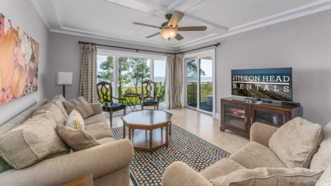 Hilton Head Rentals. A tv room with a ceiling fan