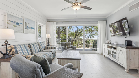 301 Barrington Arms. a living room with gray sofas