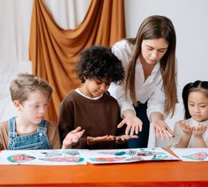 Arts Center of Coastal Carolina Summer Camps. 3 kids in what looks like an art class