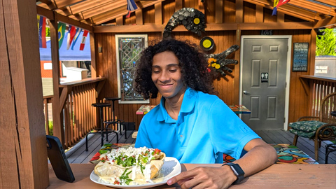 Beautiful Island Square on Hilton Head. A young man looking at a huge burrito