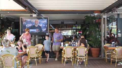 Coligny Plaza Restaurants. People at an outdoor restaurant