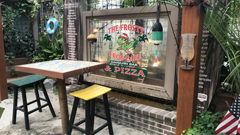 Dining near coligny beach. a small table with two stools