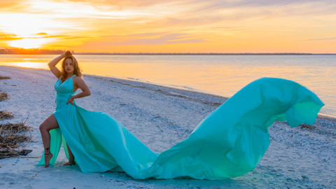 Flying Dress Hilton Head Photoshoots. Flying Dress Hilton HeadIsland Photoshoots. Woman in blue green flowing dress by the ocean
