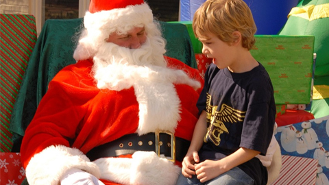 Photos with Santa on Hilton Head. a boy on santa's lap