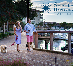 Shelter Cove Harbour & Marina. two people walking walking by a marina
