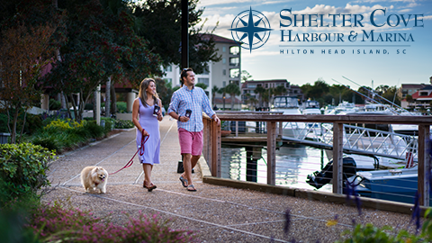 Shelter Cove Harbour & Marina. two people walking walking by a marina