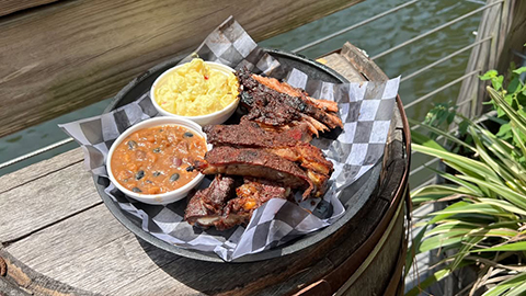 Slowcountry. bbq ribs with mac and cheese and some kind of red soup in a basket