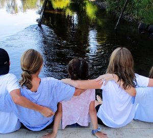 2024 Summer Camps on Hilton Head. Kids sitting on a dock