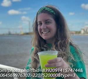 Take a Boat Cruise to Savannah for St. Patrick's. a woman on a boat wearing a green shirt