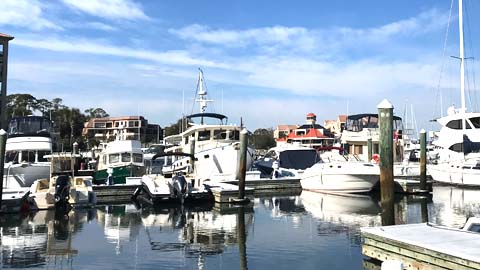 Captaining Your Own Charter. boats docked in a harbor with reflections