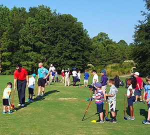 First Tee of the Lowcountry's Summer Camps for Building Confidence in Kids. Kids getting golf lessons The First Tee of the Lowcountry