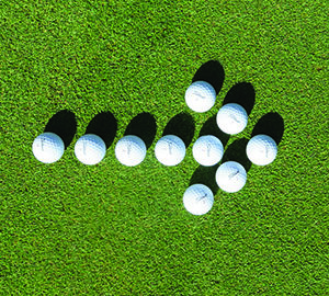 Downhill Lies On The Golf Course golf balls in the shape of an arrow